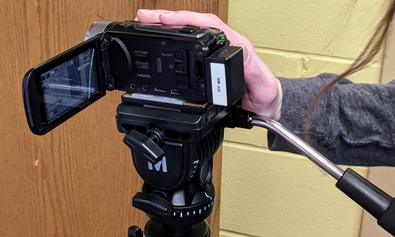 Spring 2019 PHS student checks camera before beginning to film. Photo by Nic Rosenau.