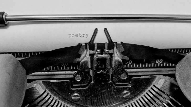 Poetry typed out on my grandmother's typewriter by Nic Rosenau on Unsplash.