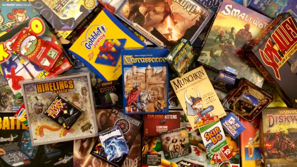 Photo of a jumble of tabletop game boxes, 2016, by Nic Rosenau, CC BY-SA 4.0.