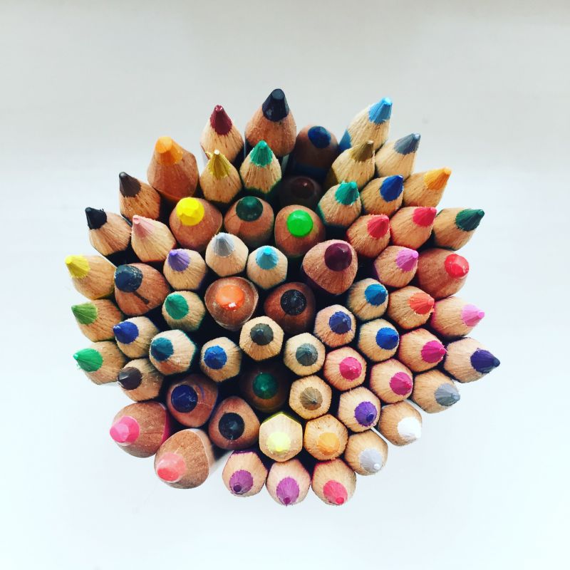 A top-down photo of a bundle of sharpened colored pencils.
