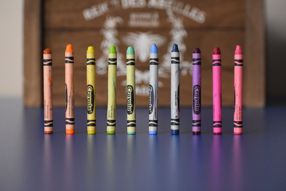 A row of crayons, 2018. Photo by Josh Eckstein on Unsplash.