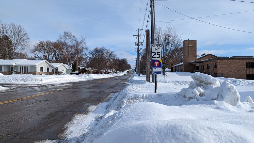 The snowy bus stop at Belden Dr and 33rd Ave NE. 2023. Photo by Nic Rosenau. CC BY-SA 4.0.