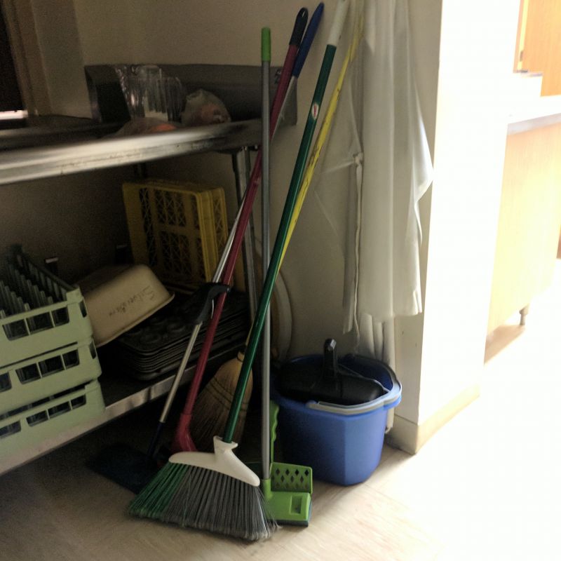 commerical mop and bucket in the utility closet