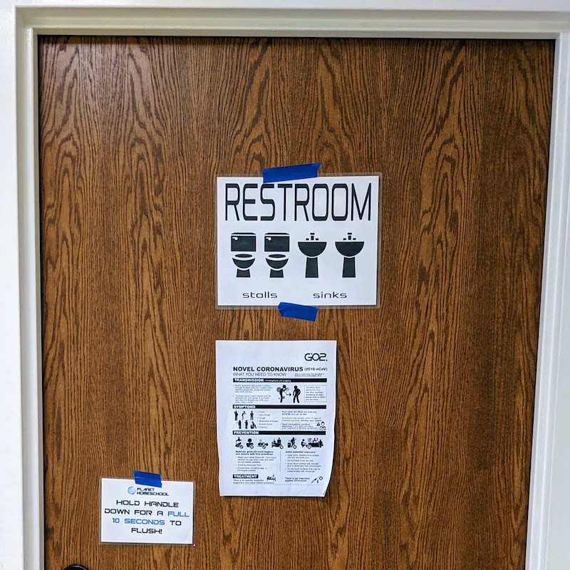 stalls and sinks sign for east restroom